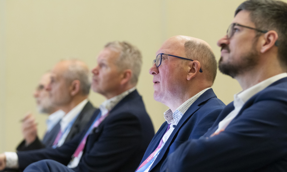 Image of delegates, including Joost Vantomme at a conference panel