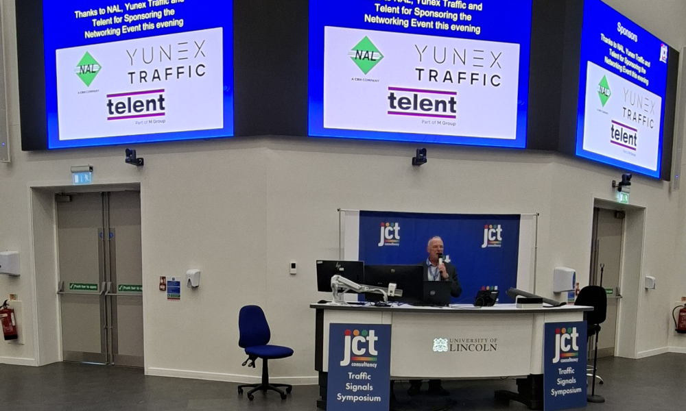 Image of John Nightingale from JCT, welcoming delegates to the symposium  