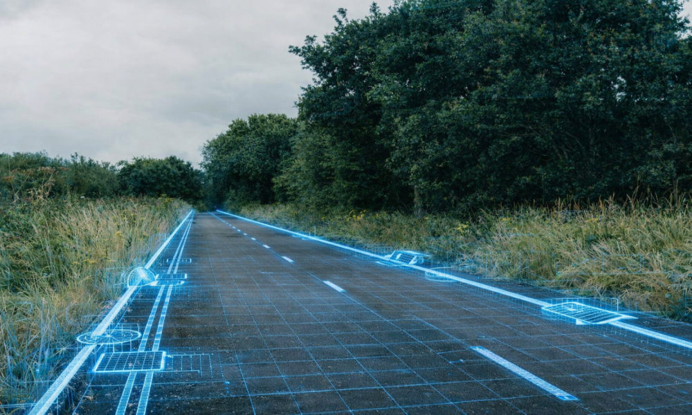 An illustration of a digital twin model overlaid on a highway 