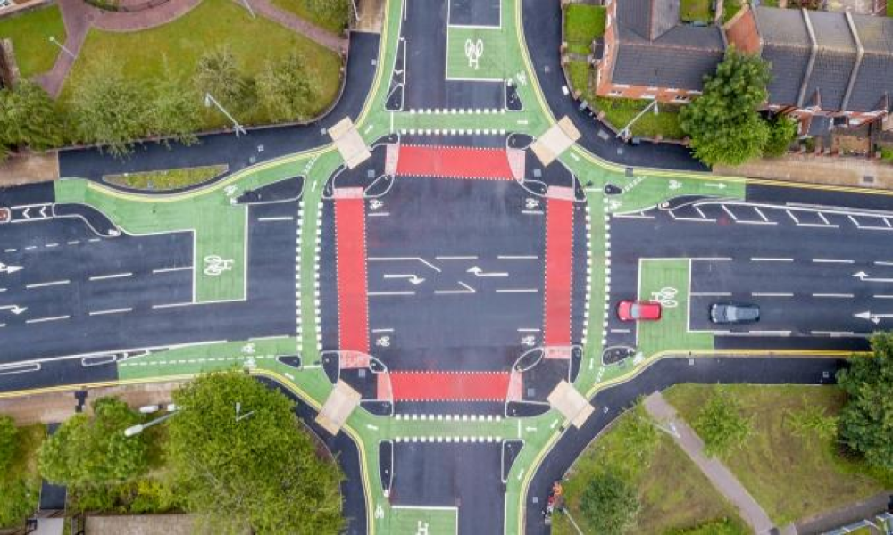 A picture of an aerial view of a cyclops junction, illustrating the seperate pedestrian, cycle and vehicular lanes